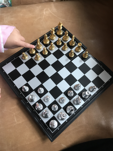 Photo of Edge pointing to the first ever setup of Edgy Chess